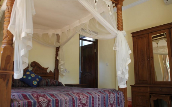 kamar tidur di Bembengan Ubud Cottage