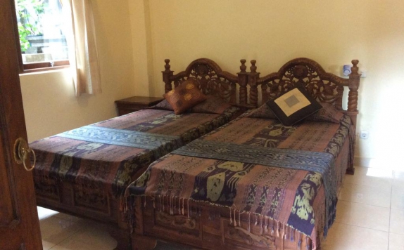 kamar tidur di Bembengan Ubud Cottage
