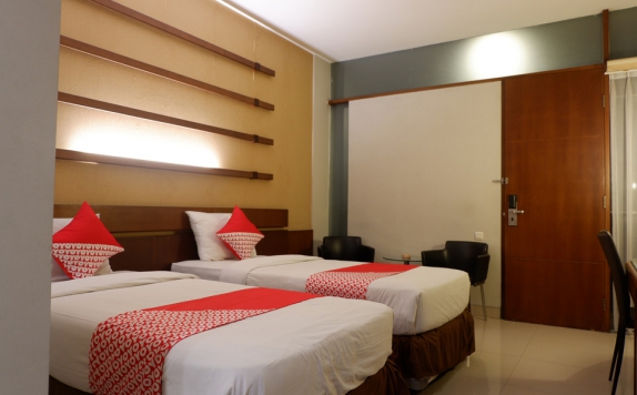Tampilan Bedroom Hotel di Capital O 874 Hotel Nyland Pasteur