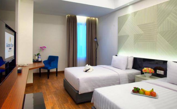 guest room twin bed di Golden Tulip Essential Makassar