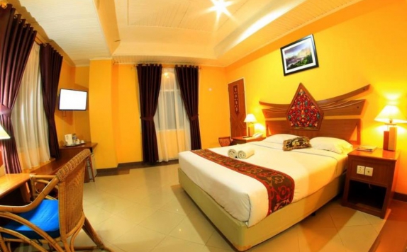 kamar tidur di Kharisma Mega Asia Sentosa Hotel
