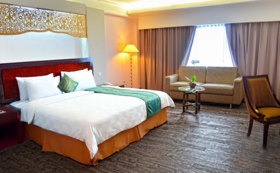 kamar tidur di Kyriad Hotel Bumiminang