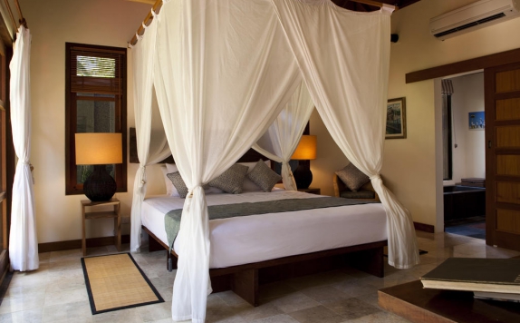 kamar tidur di Mango Tree Villas
