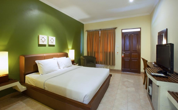 Double bed di Mutiara Bali Boutique Resort & Villas