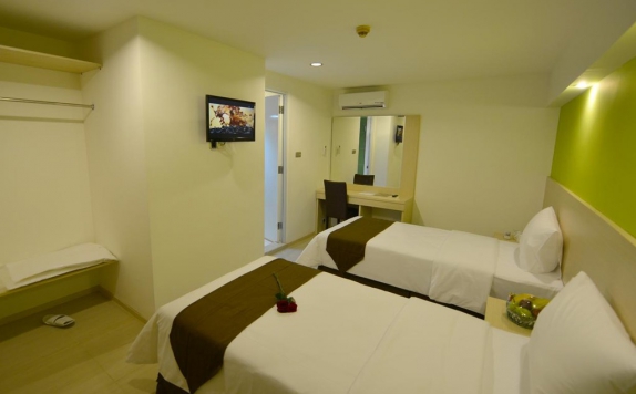 kamar tidur di The Naripan Hotel