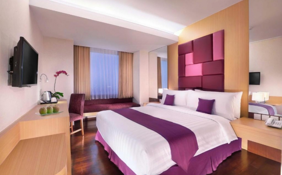 Bedroom di Quest Hotel Darmo - Surabaya by ASTON