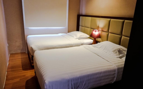 guest room twin bed di Royal Suite Condotel