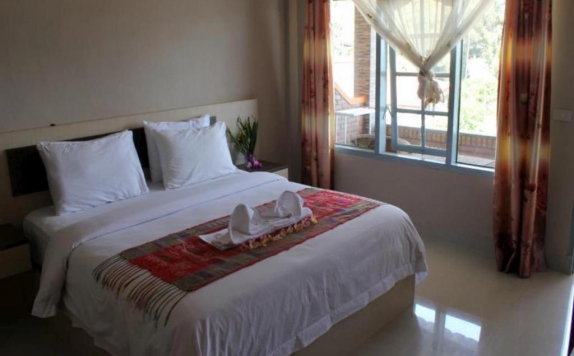 kamar tidur di Samosir Cottages resort