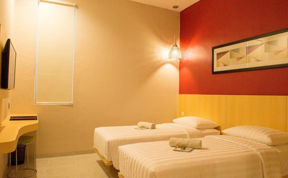 kamar tidur di The Luxe Boutique Guest House