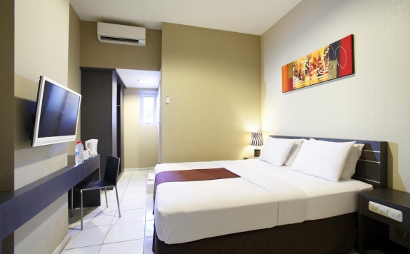 Kamar tidur di The Sunset Point Hotel