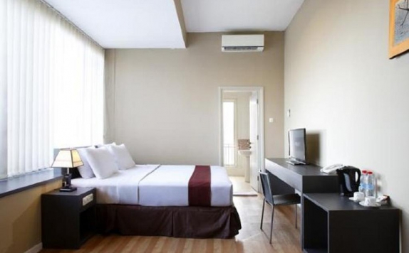 Kamar tidur di The Sunset Point Hotel