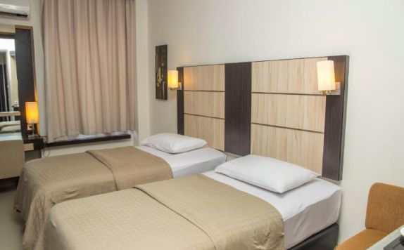 guest room twin bed di Travello Hotel