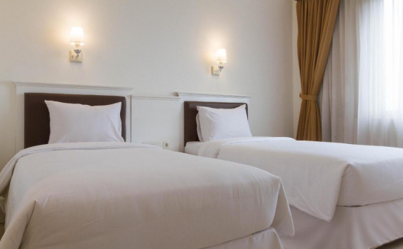 guest room twin bed di Vue Palace Hotel