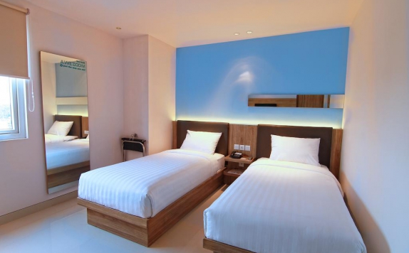 Twin bed di Zoom Jemursari Hotel
