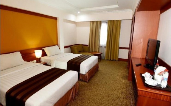 Bedroom di Abadi Suite Hotel & Tower