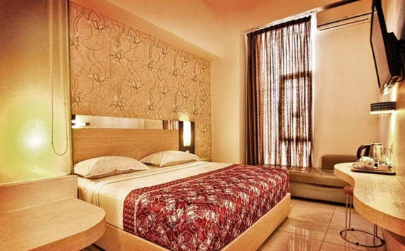 Tampilan Bedroom Hotel di Dewarna Hotel Sutoyo