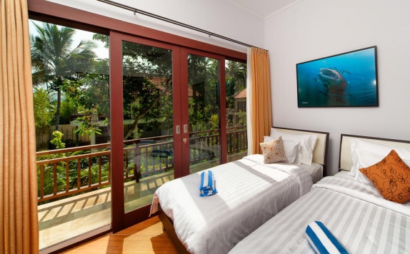 Kamar tidur di Discovery Candidasa Cottages and Villas