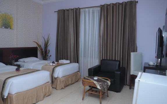 kamar tidur di Griya Hotel Medan