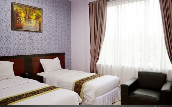 kamar tidur di Griya Hotel Medan