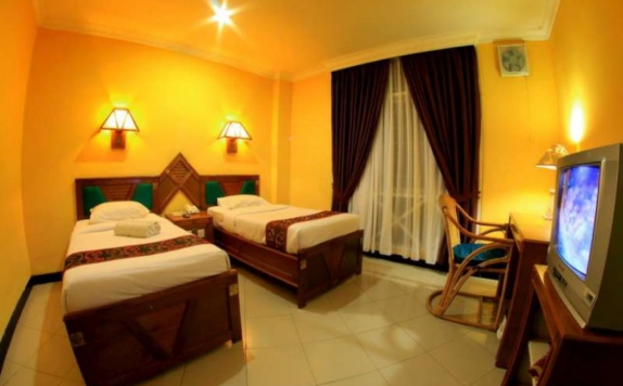 kamar tidur di Kharisma Mega Asia Sentosa Hotel