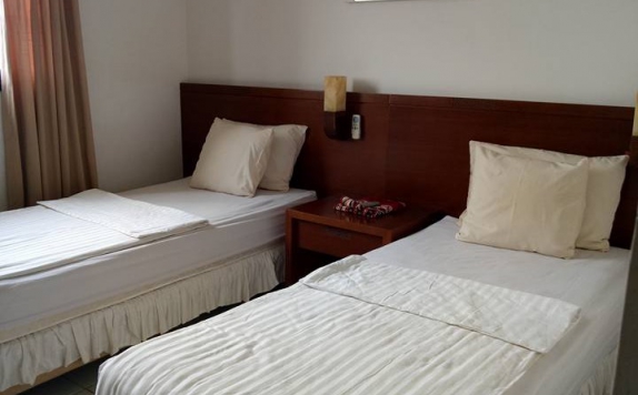 kamar tidur di LARIZ Alauddin Hotel & Convention