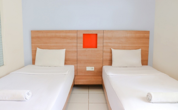 Tampilan Bedroom Hotel di LeGreen Suite Waihaong