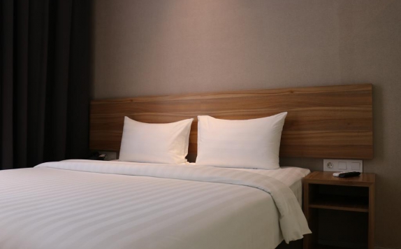 Bedroom di TravelHub Hotel