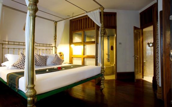 kamar tidur di Tugu Malang Hotel
