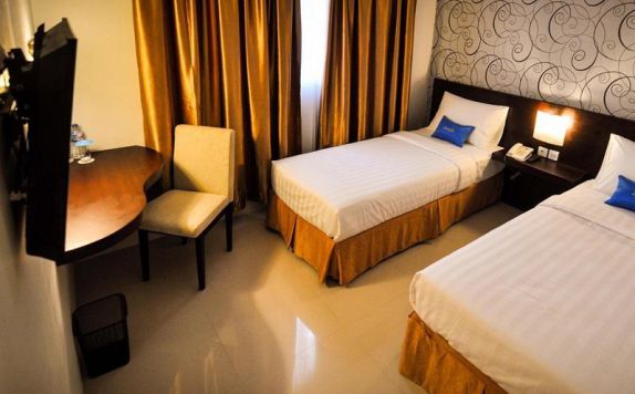 guest room twin bed di Zenith Hotel